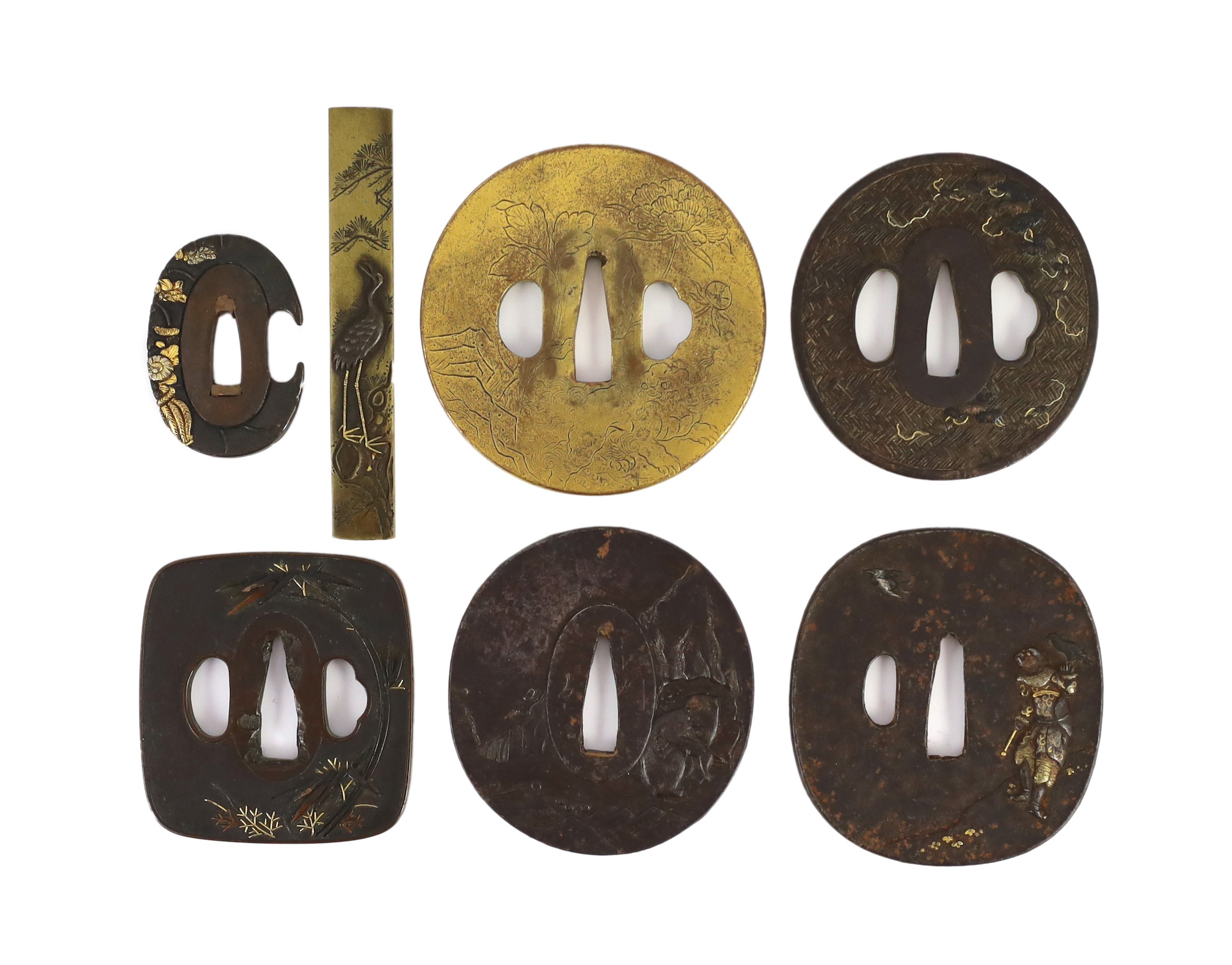 A group of Japanese bronze, iron and mixed metal tsuba and a kozuka knife handle, 19th century